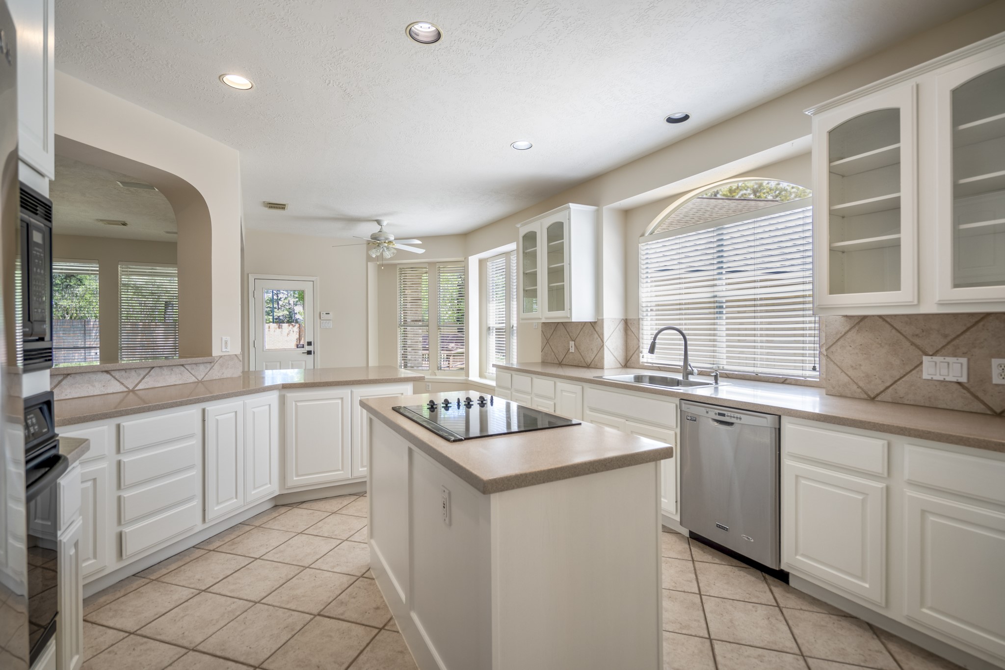 1322 Cardigan Bay Circle Spring, TX 77379 - Photo 18 of 50 The kitchen is equipped with modern stainless steel appliances, including a built-in microwave, wall oven, and a French-door refrigerator. All appliances included!!