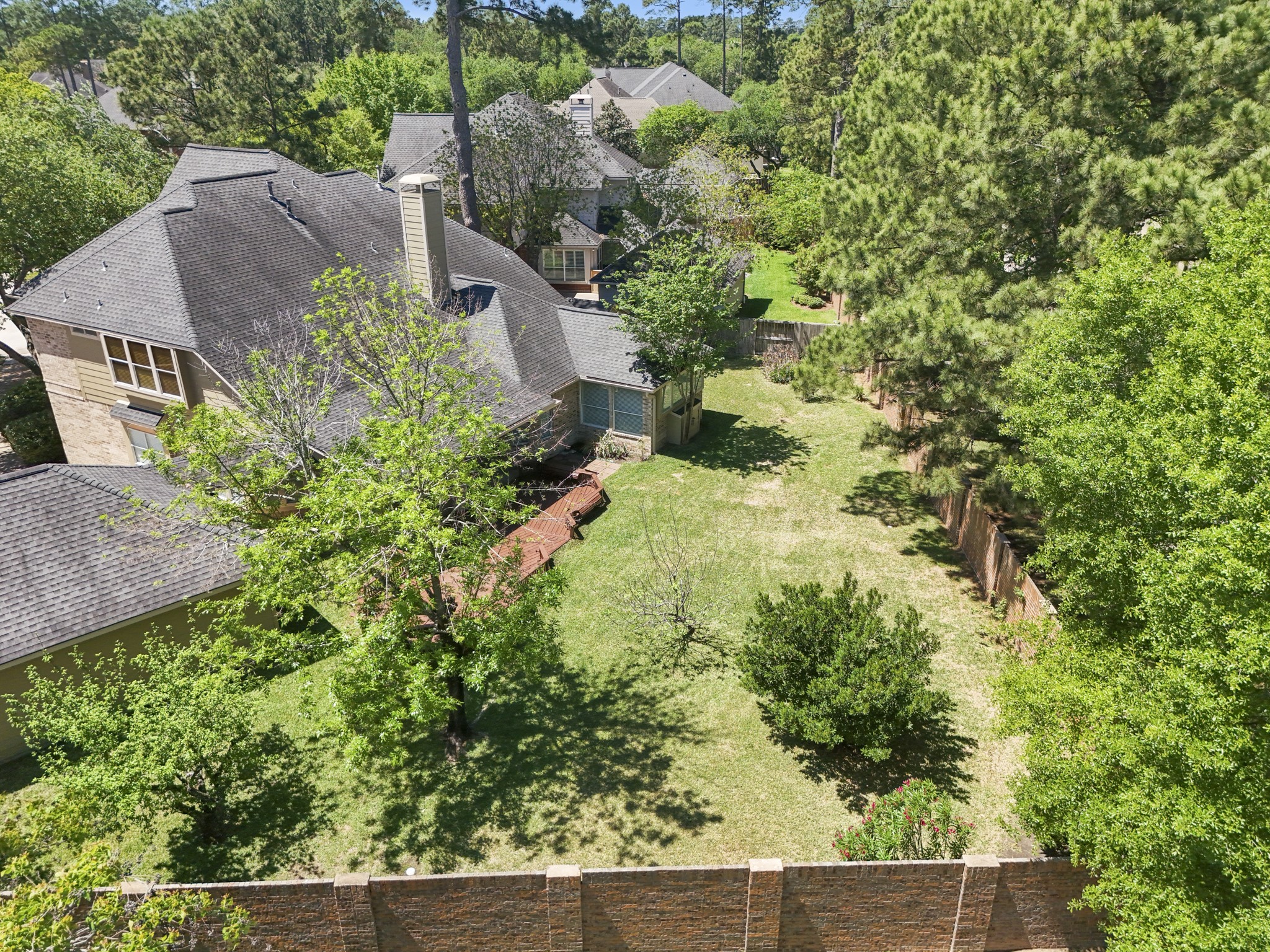1322 Cardigan Bay Circle Spring, TX 77379 - Photo 2 of 50 An aerial view of the home, surrounded by majestic trees and within walking distance to the main recreation center that includes tennis courts, pool, lake and playground, and the elementary school Hassler.