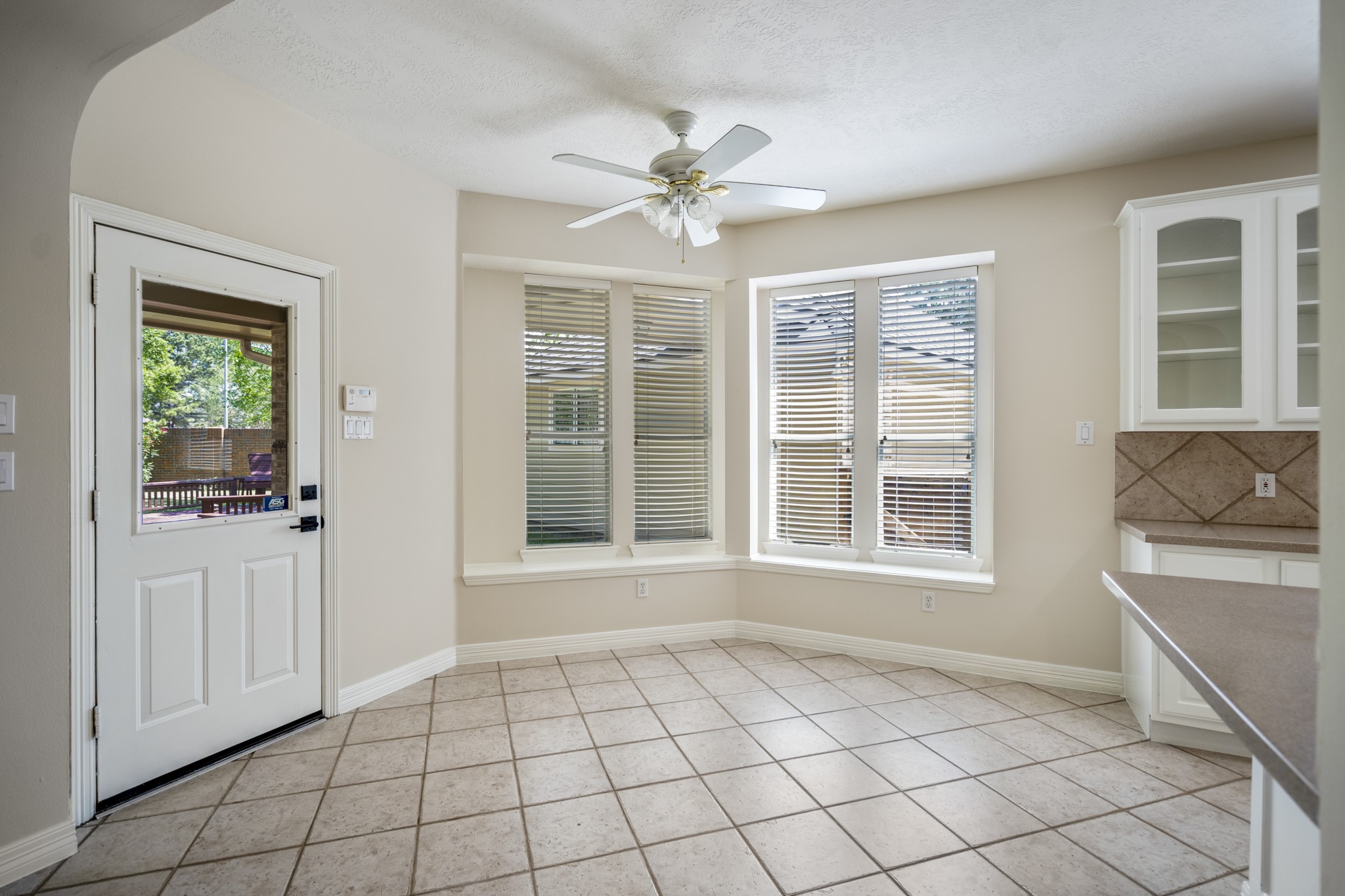 1322 Cardigan Bay Circle Spring, TX 77379 - Photo 19 of 50 The corner breakfast room offers lots of natural light from the large windows, and a door leading out onto the covered patio.