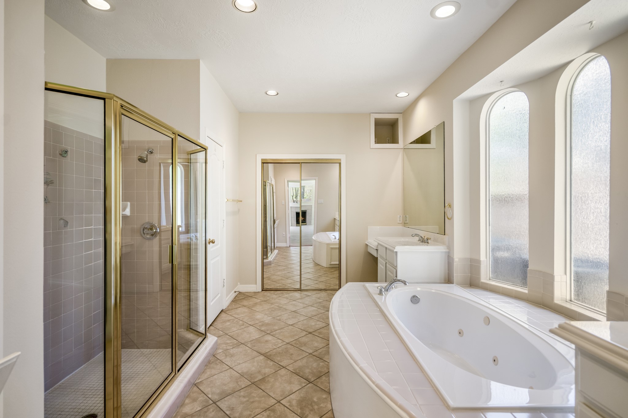 1322 Cardigan Bay Circle Spring, TX 77379 - Photo 26 of 50 Natural light floods the en-suite bathroom, which also has overhead subtle lighting and t ask lighting.