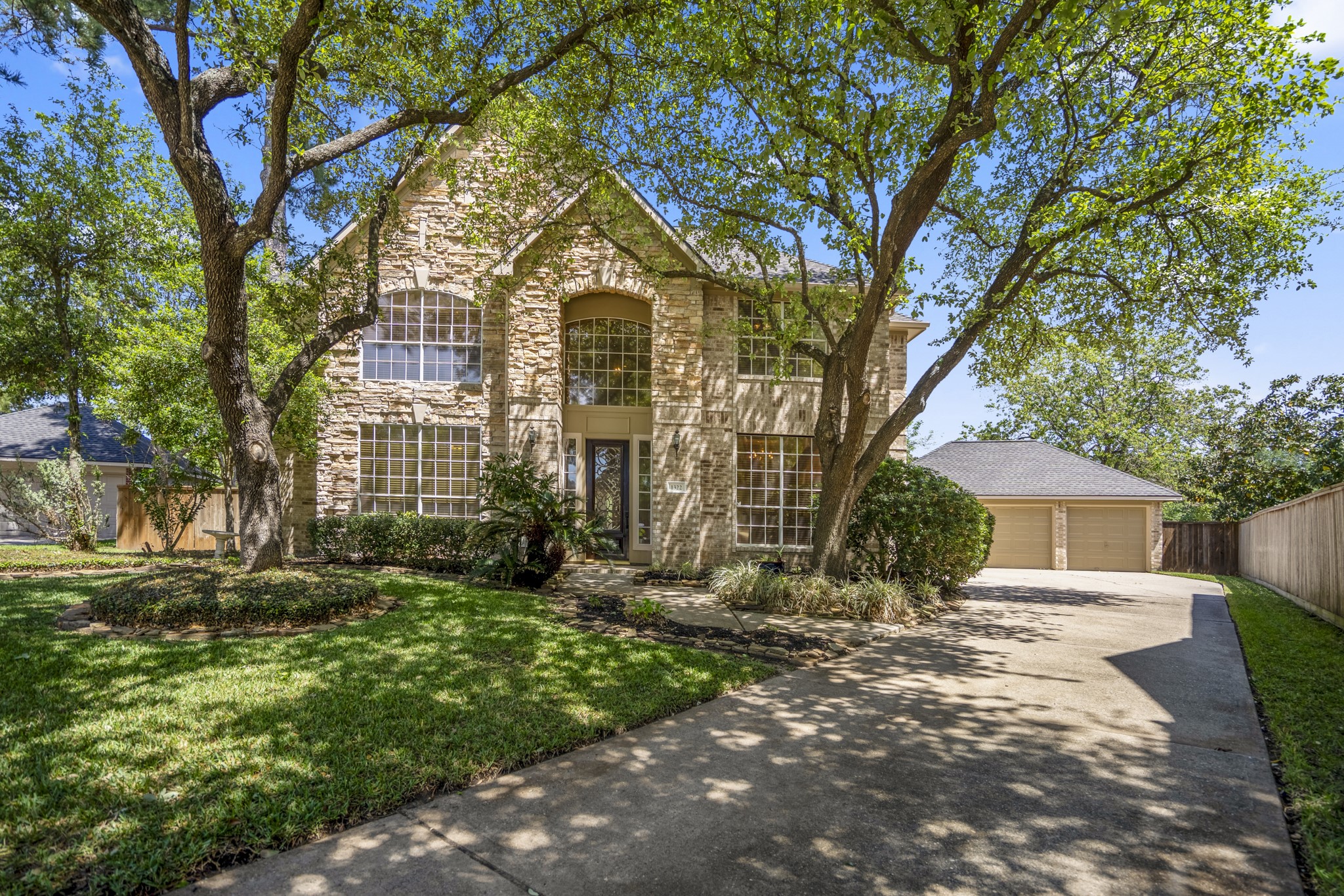 1322 Cardigan Bay Circle Spring, TX 77379 - Photo 3 of 50 Framed by grand shade trees, you have a fantastic opportunity to customize this home that has amazing bones, and is packed with potential and ready for your vision.