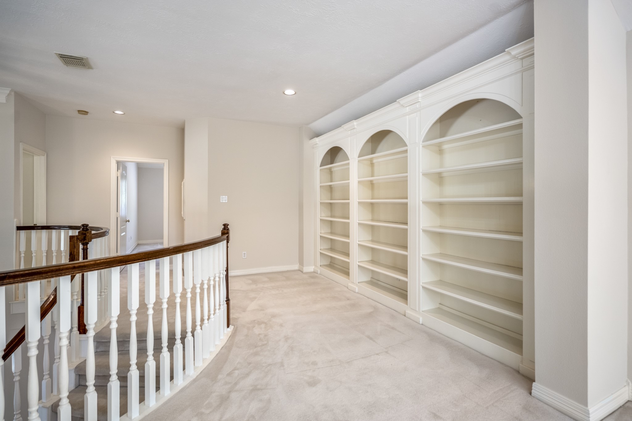 1322 Cardigan Bay Circle Spring, TX 77379 - Photo 31 of 50 The loft has these custom built-in shelves, which provide a wonderful storage space for books, games, and all your media related games.