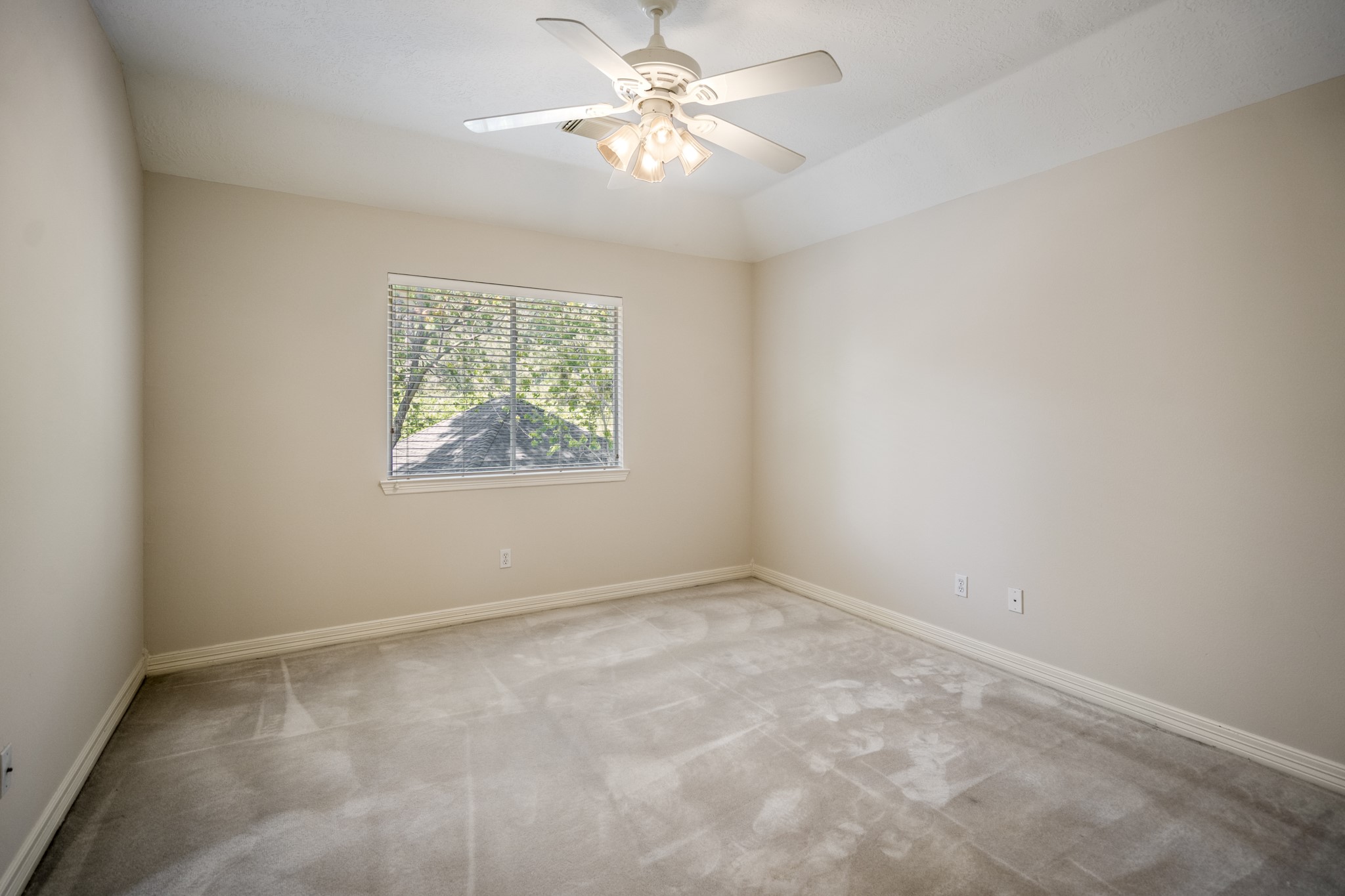 1322 Cardigan Bay Circle Spring, TX 77379 - Photo 34 of 50 The fourth bedroom offers a nice size room with closet, neutral tones, a good size window, and an angled ceiling.