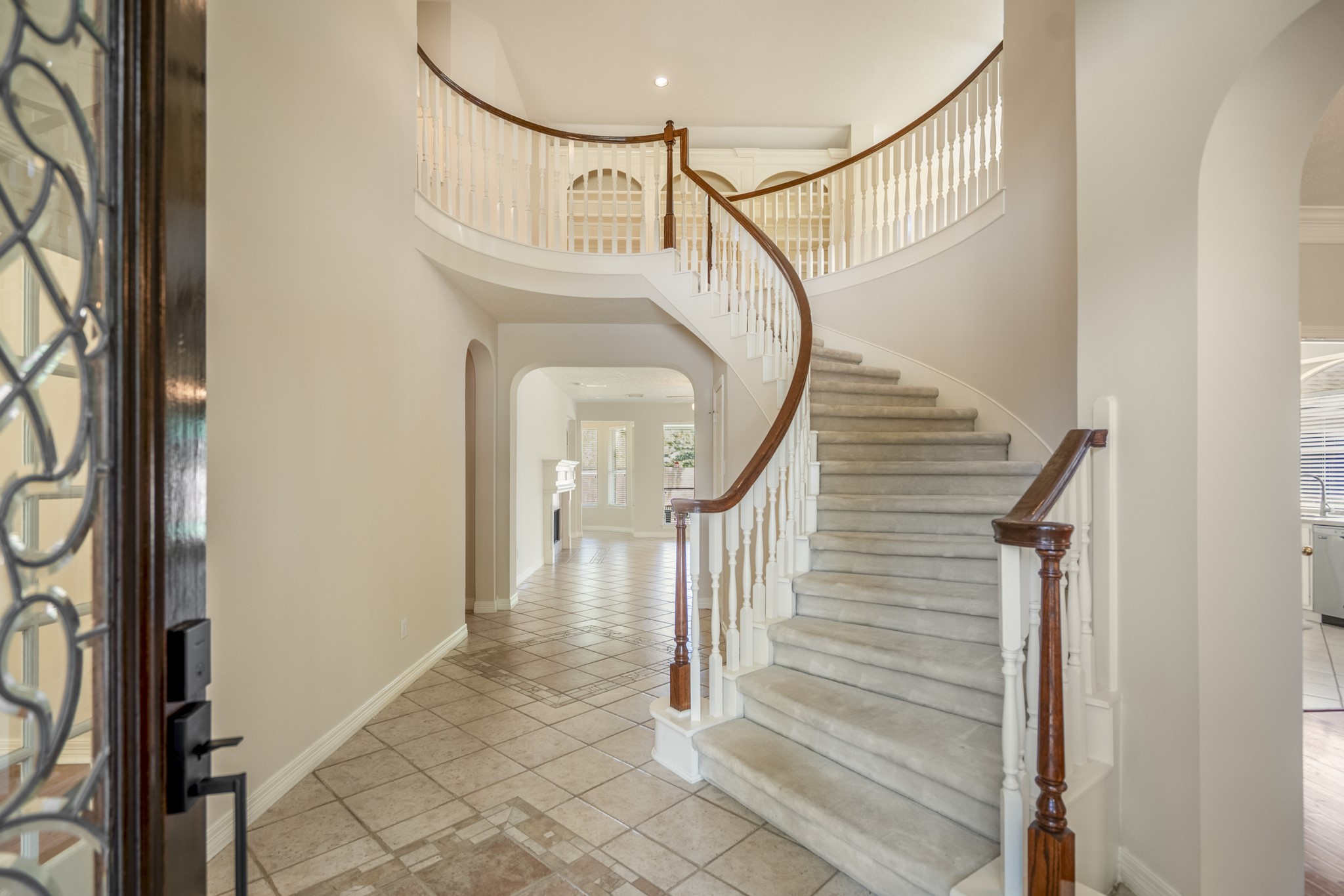 1322 Cardigan Bay Circle Spring, TX 77379 - Photo 5 of 50 As you enter the home you have a lead glass door with wood surround, a large 2-story foyer and spiral staircase.