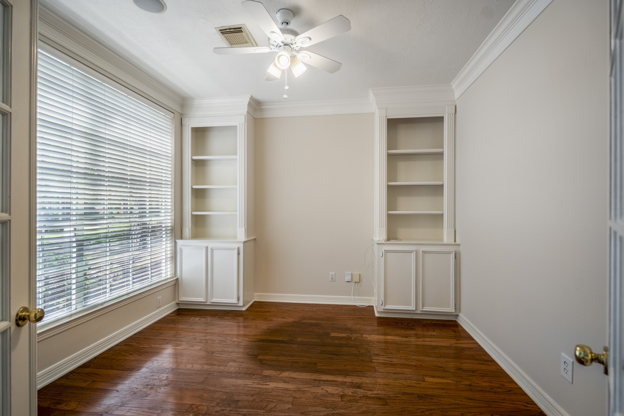 1322 Cardigan Bay Circle Spring, TX 77379 - Photo 8 of 50 The study is at the front of the home, for the convenience of your work from home scenario, with neutral tones, built-in and lots of natural and overhead light.