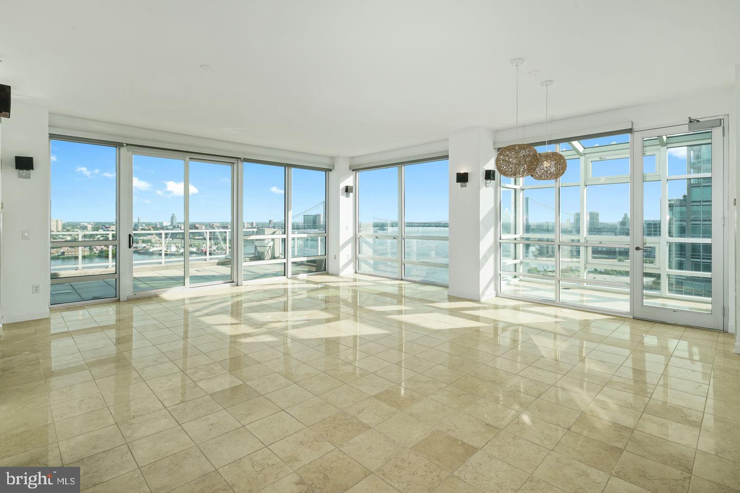 901 North Penn Street, Unit R1802 Philadelphia, PA 19123 - Photo 1 of 32 a view of an empty room with a window