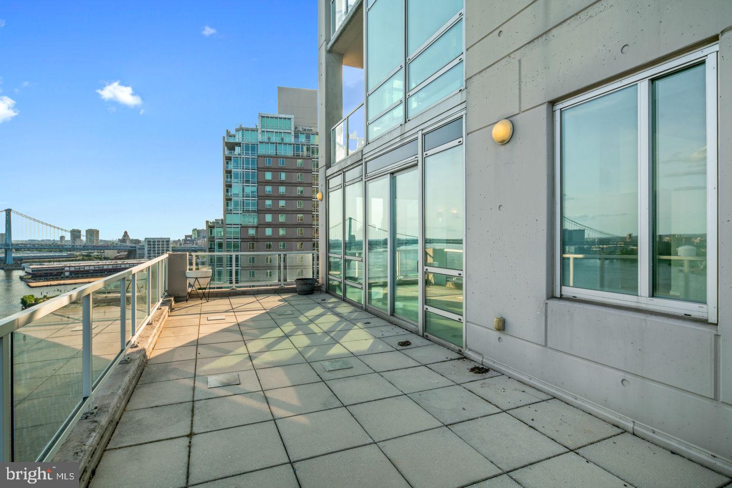 901 North Penn Street, Unit R1802 Philadelphia, PA 19123 - Photo 26 of 32 a view of a terrace with chairs