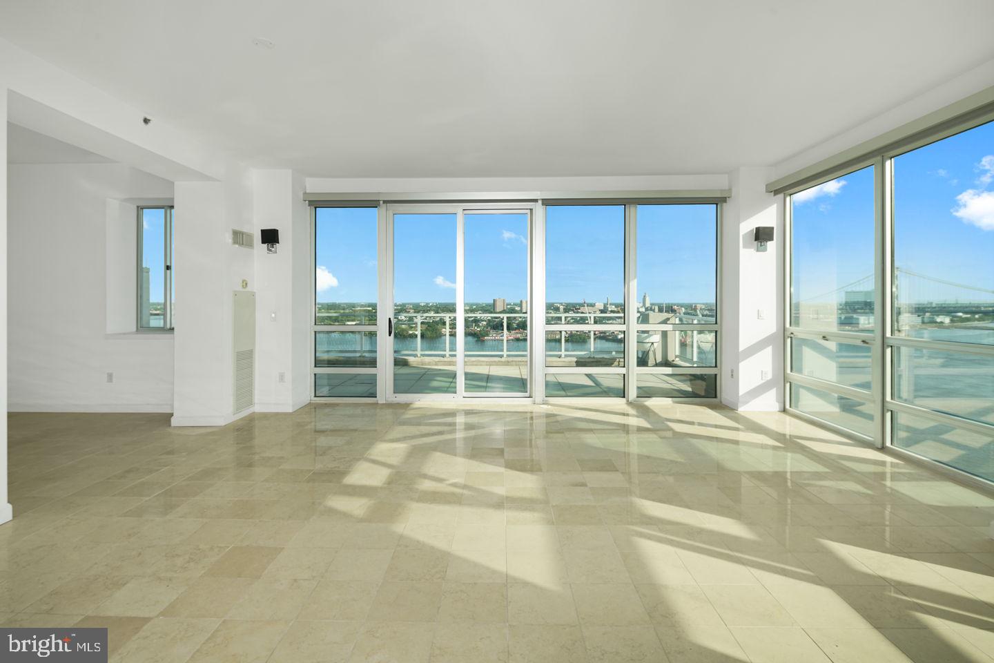 901 North Penn Street, Unit R1802 Philadelphia, PA 19123 - Photo 4 of 32 a view of an empty room with a window