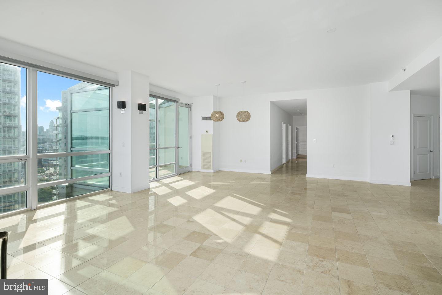 901 North Penn Street, Unit R1802 Philadelphia, PA 19123 - Photo 5 of 32 a view of a big room with windows and entryway