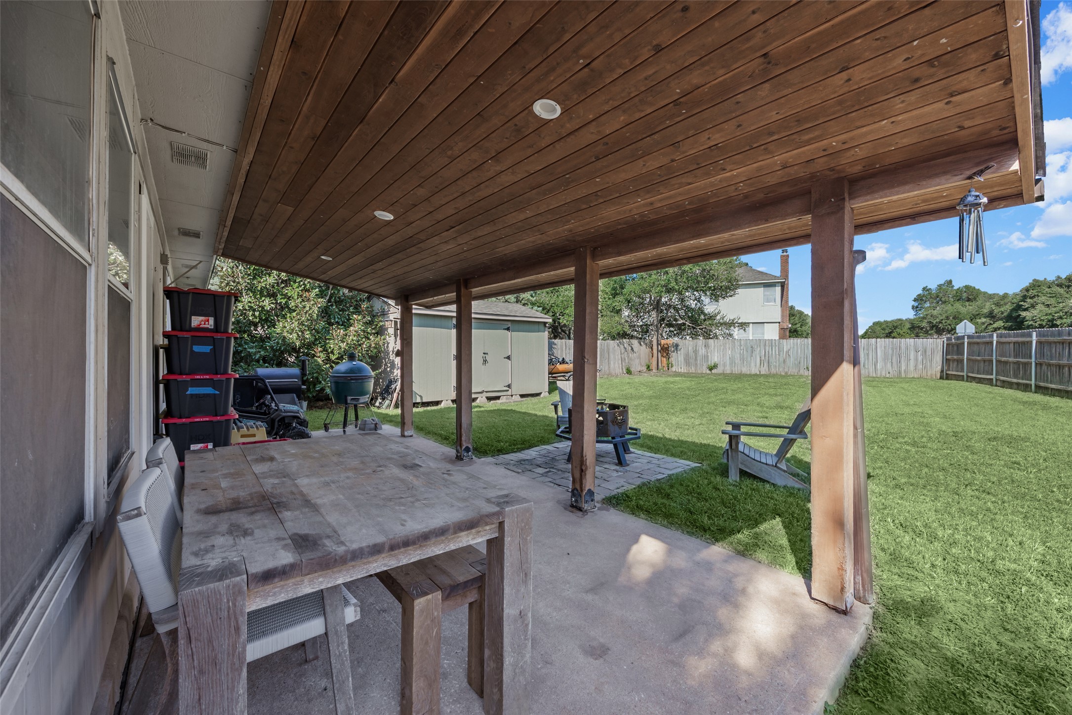 15918 Two Rivers Cove Austin, TX 78717 - Photo 29 of 30 Covered patio leading to the large fenced backyard with storage shed, sprinkler system, and more.