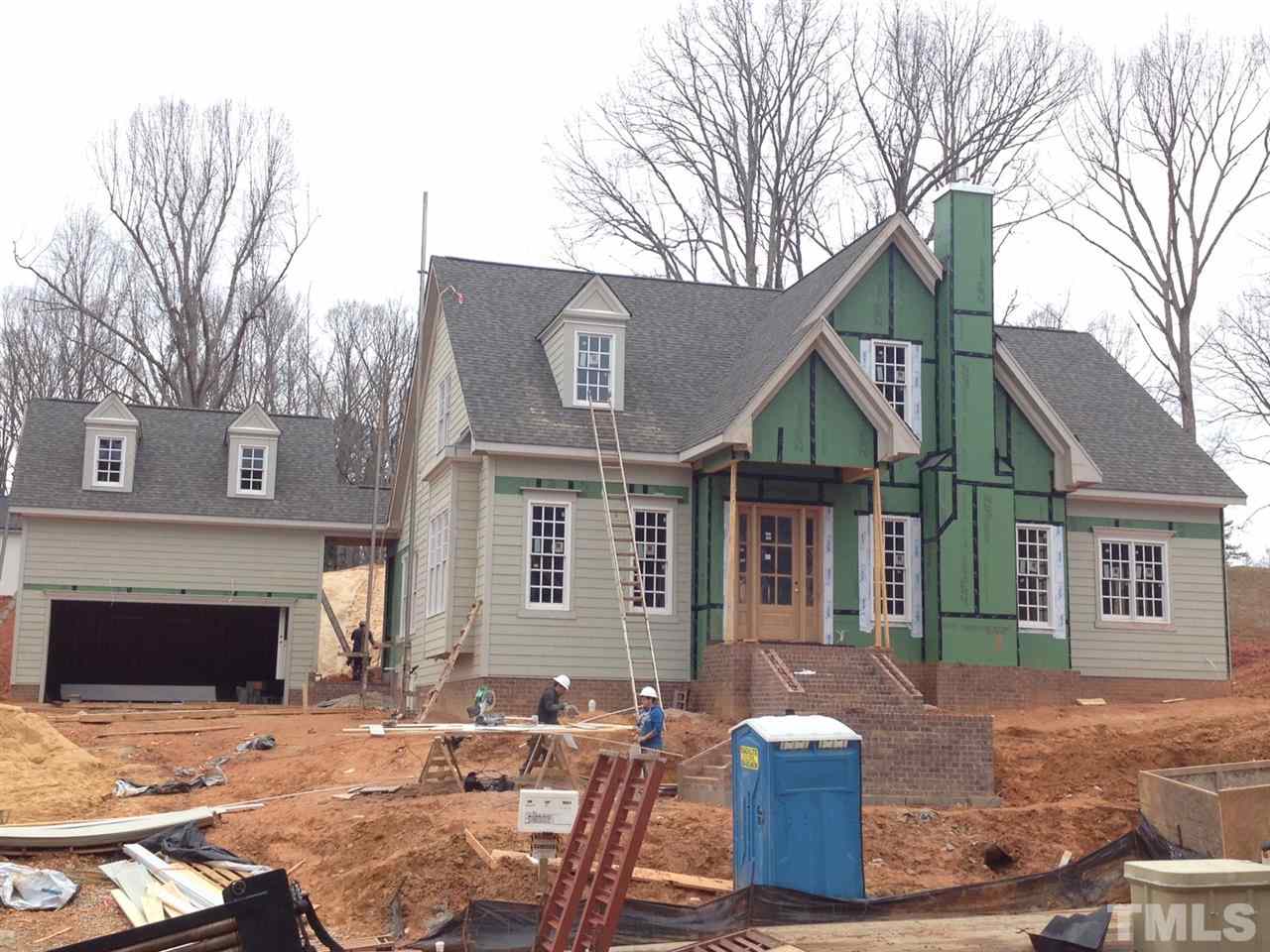 5205 Woodall Way, Unit 19 Raleigh, NC 27613 - Photo 1 of 5 a front view of a house with a yard