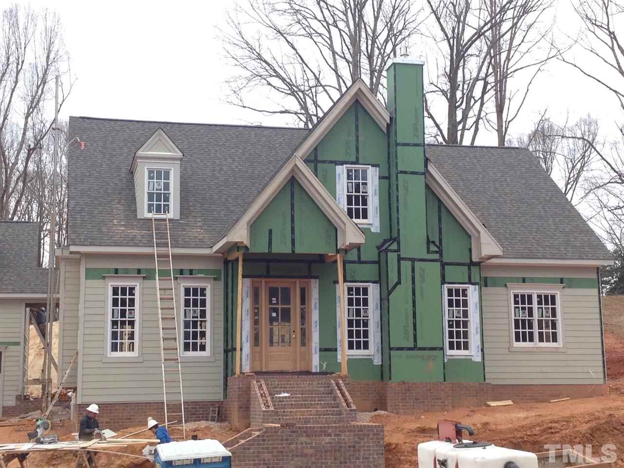 5205 Woodall Way, Unit 19 Raleigh, NC 27613 - Photo 2 of 5 a front view of a house with a yard