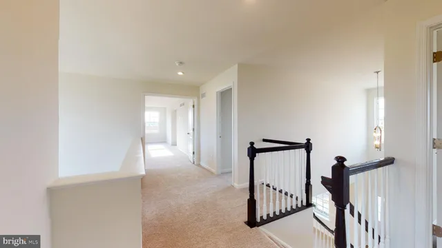 a view of a hallway with staircase