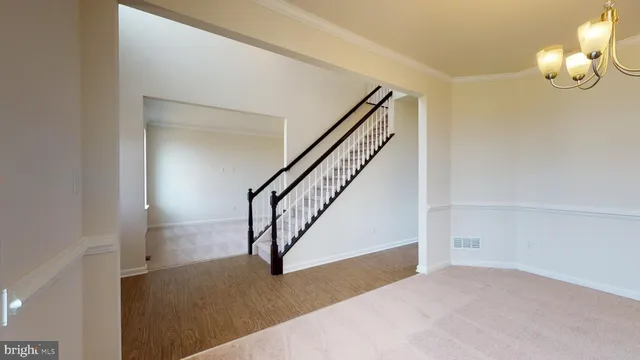 a view of entryway and hall with a front door
