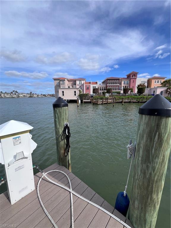 4090 Gulf Shore Boulevard North, Unit 1 Naples, FL 34103 - Photo 12 of 13 a view of a lake from a balcony