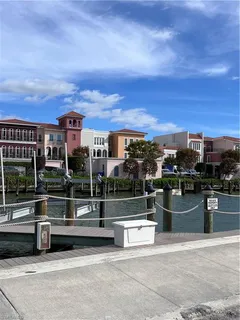 a view of a roof deck with couches and wooden floor