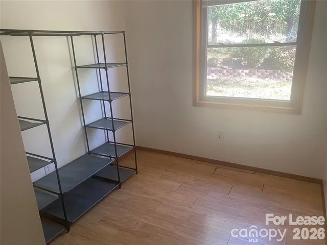 a view of a livingroom with furniture and a window