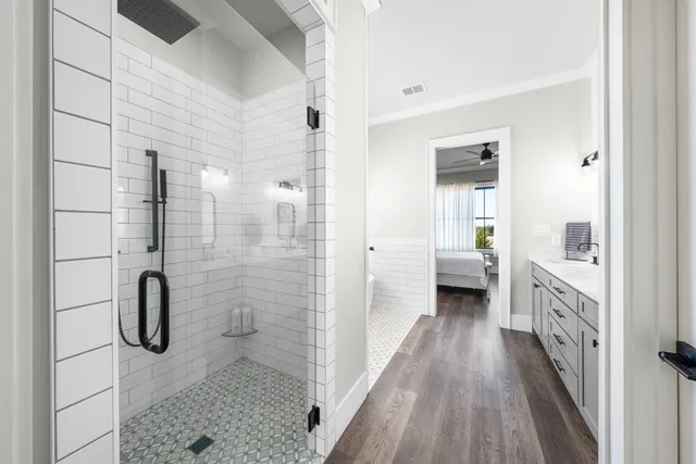 a bathroom with a granite countertop shower