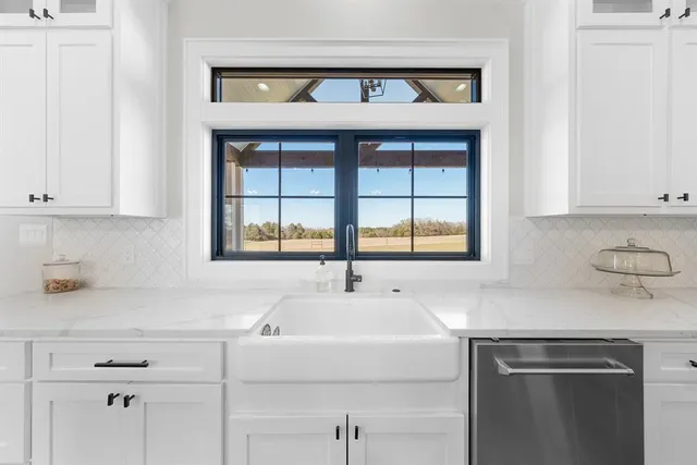 a kitchen with a sink and cabinets