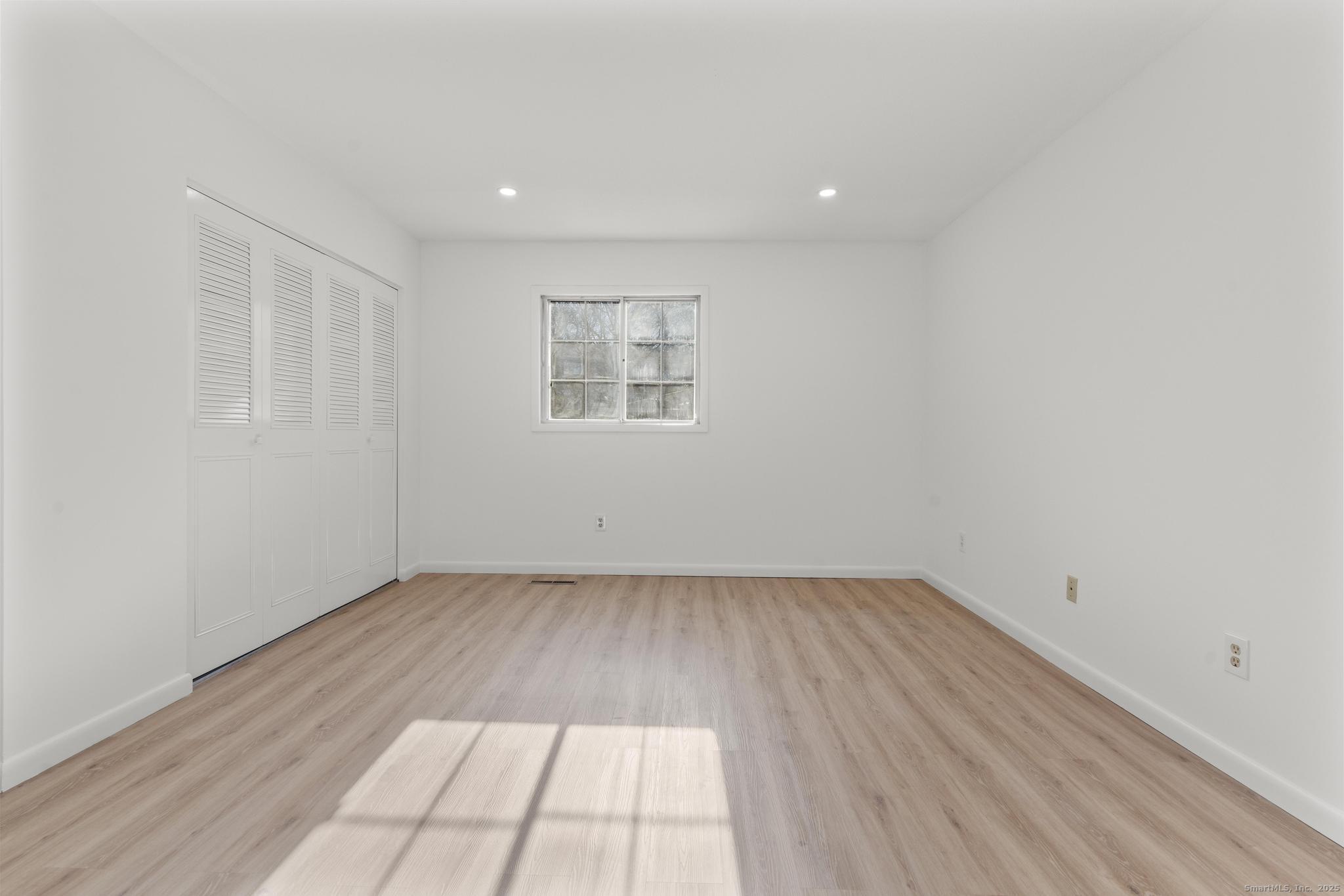 65 Patricia Road, Unit N Bridgeport, CT 06606 - Photo 14 of 25 wooden floor in a empty room