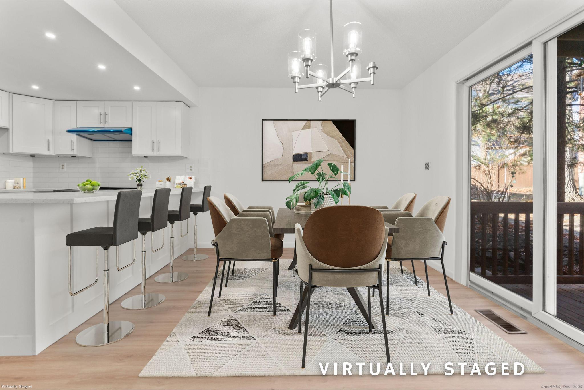 65 Patricia Road, Unit N Bridgeport, CT 06606 - Photo 6 of 25 a dining room filled chandelier and kitchen view