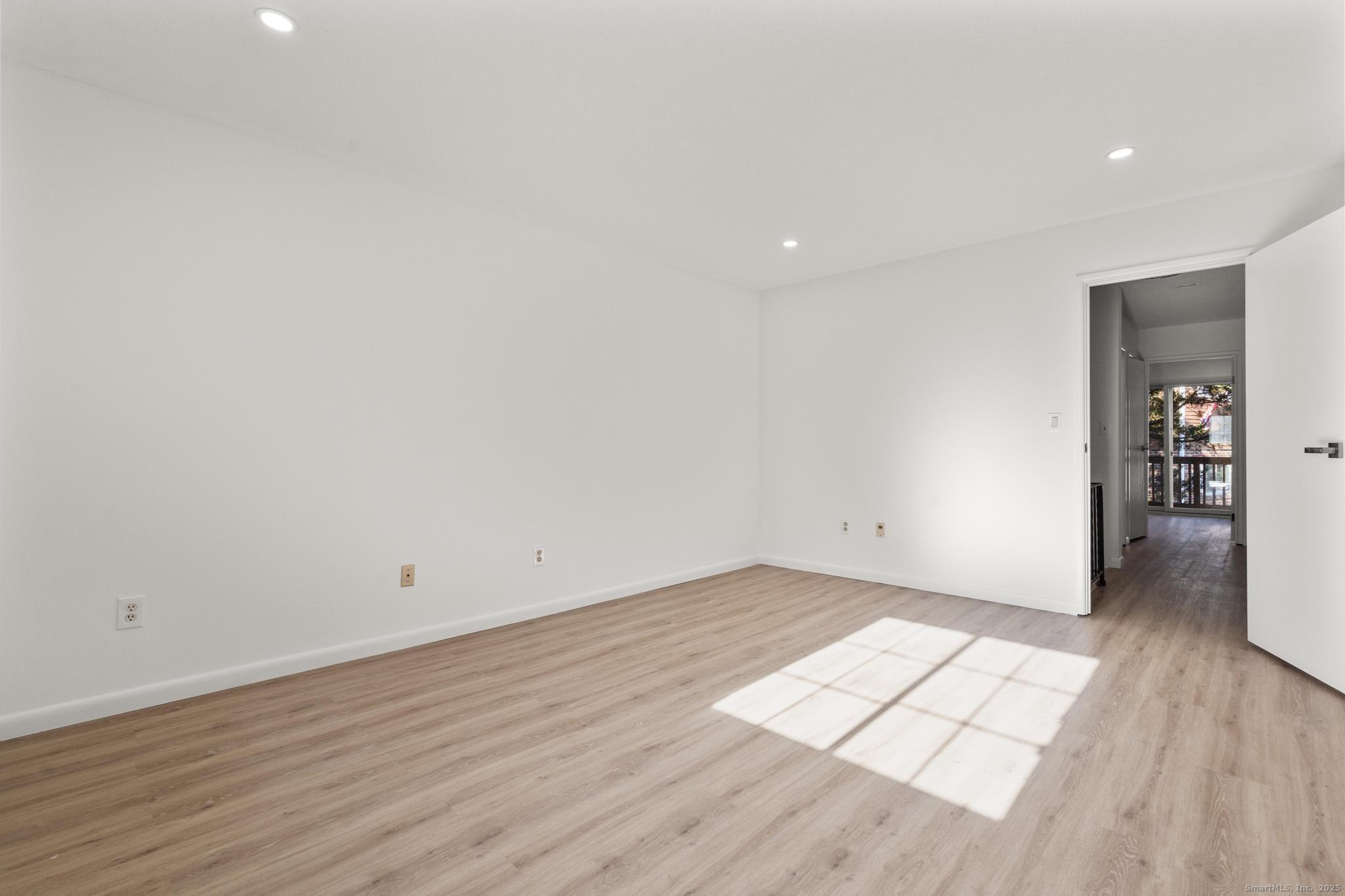 65 Patricia Road, Unit N Bridgeport, CT 06606 - Photo 7 of 25 wooden floor in an empty room