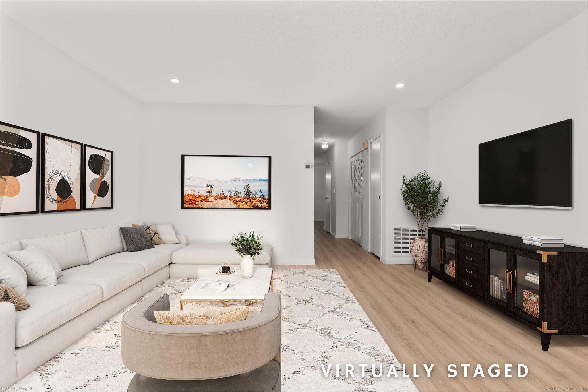65 Patricia Road, Unit N Bridgeport, CT 06606 - Photo 9 of 25 a living room with furniture and a flat screen tv