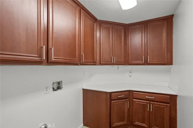 a view of a kitchen with furniture and wooden floor