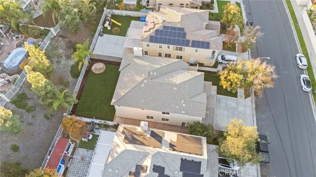 an aerial view of a house with a yard