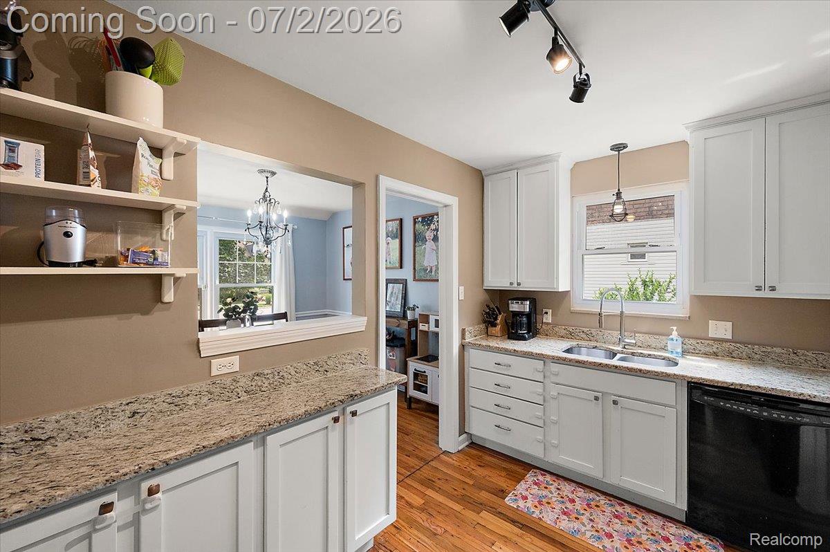 1706 Princeton Road Berkley, MI 48072 - Photo 15 of 49 Kitchen featuring wood-finish flooring, white cabinetry, and granite-style countertops