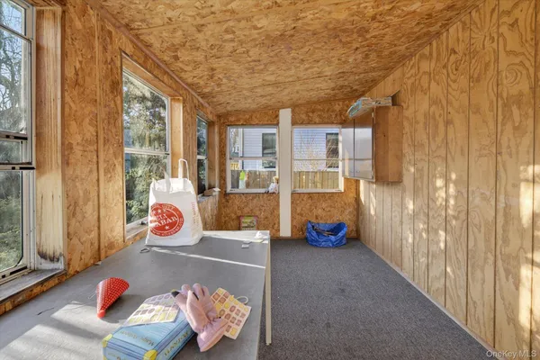 a view of a room with furniture and toys