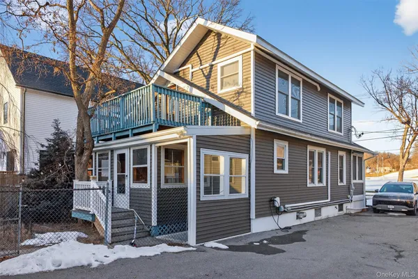 a front view of a house with parking space