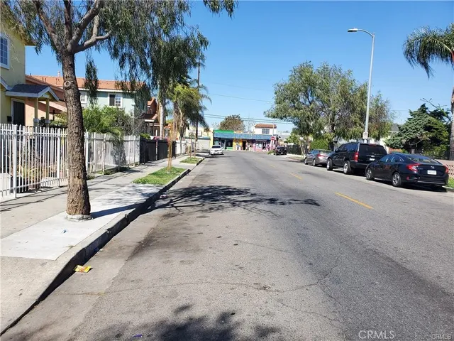 a view of street with parked cars