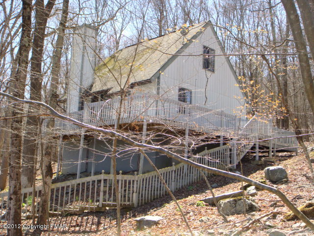 2384 Decker Road Bushkill, PA 18324 - Photo 1 of 10 a view of a house with a yard and wooden fence