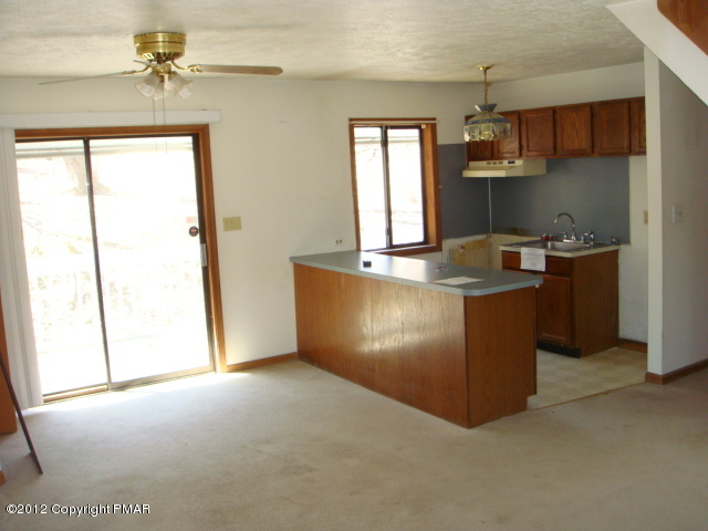 2384 Decker Road Bushkill, PA 18324 - Photo 2 of 10 view of a kitchen with a sink a window and appliances