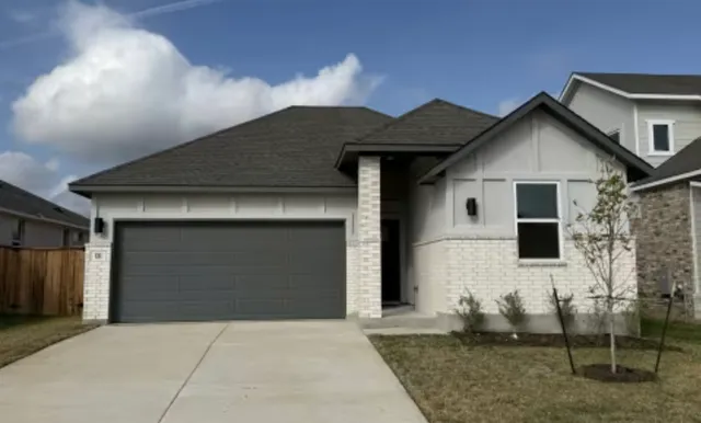a front view of house with yard