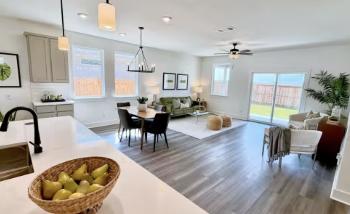 131 Sincere Drive Kyle, TX 78640 - Photo 3 of 15 a living room with furniture a dining table and a large window