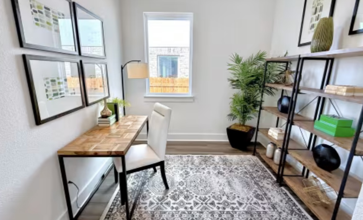 131 Sincere Drive Kyle, TX 78640 - Photo 9 of 15 a living room with furniture and a potted plant