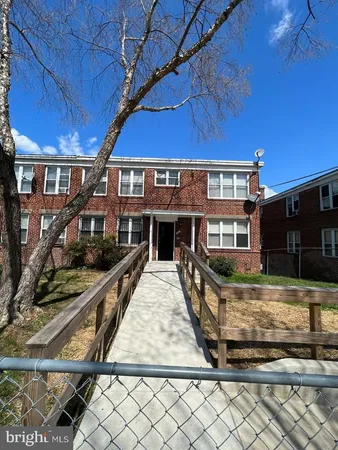 a view of a house with wooden deck