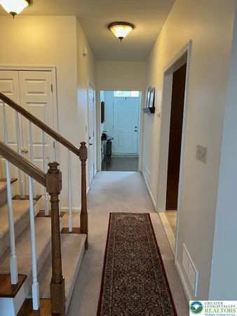 a view of hallway with wooden floor