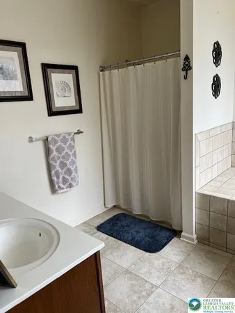 a bathroom with a sink and a bathtub