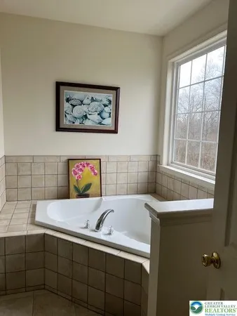 a bed room with a bed and a mirror