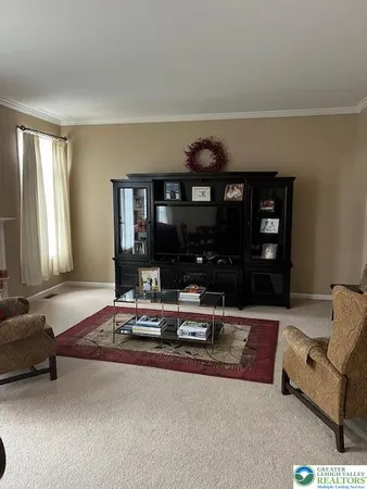 a living room with furniture a window and couch