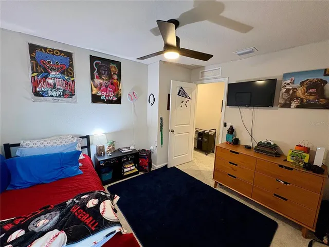 a bedroom with a bed and furniture