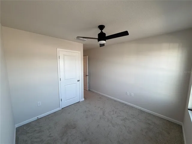a view of a small space with a fan