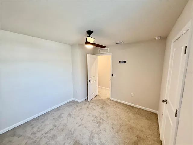 a view of a hallway with closet