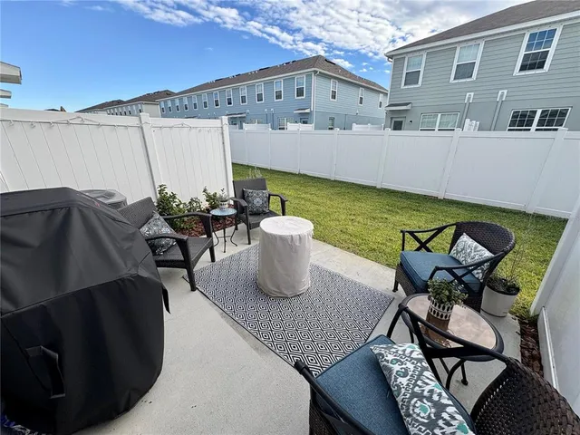a view of swimming pool with outdoor seating