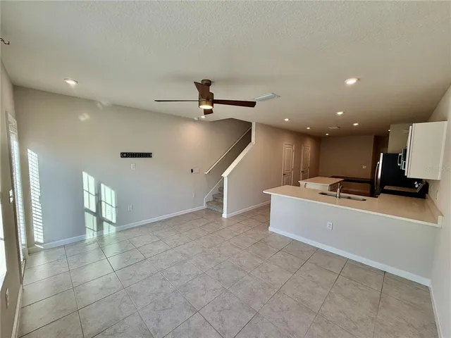 a view of a livingroom with a staircase
