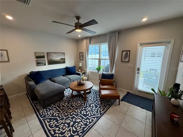 a living room with furniture and a window