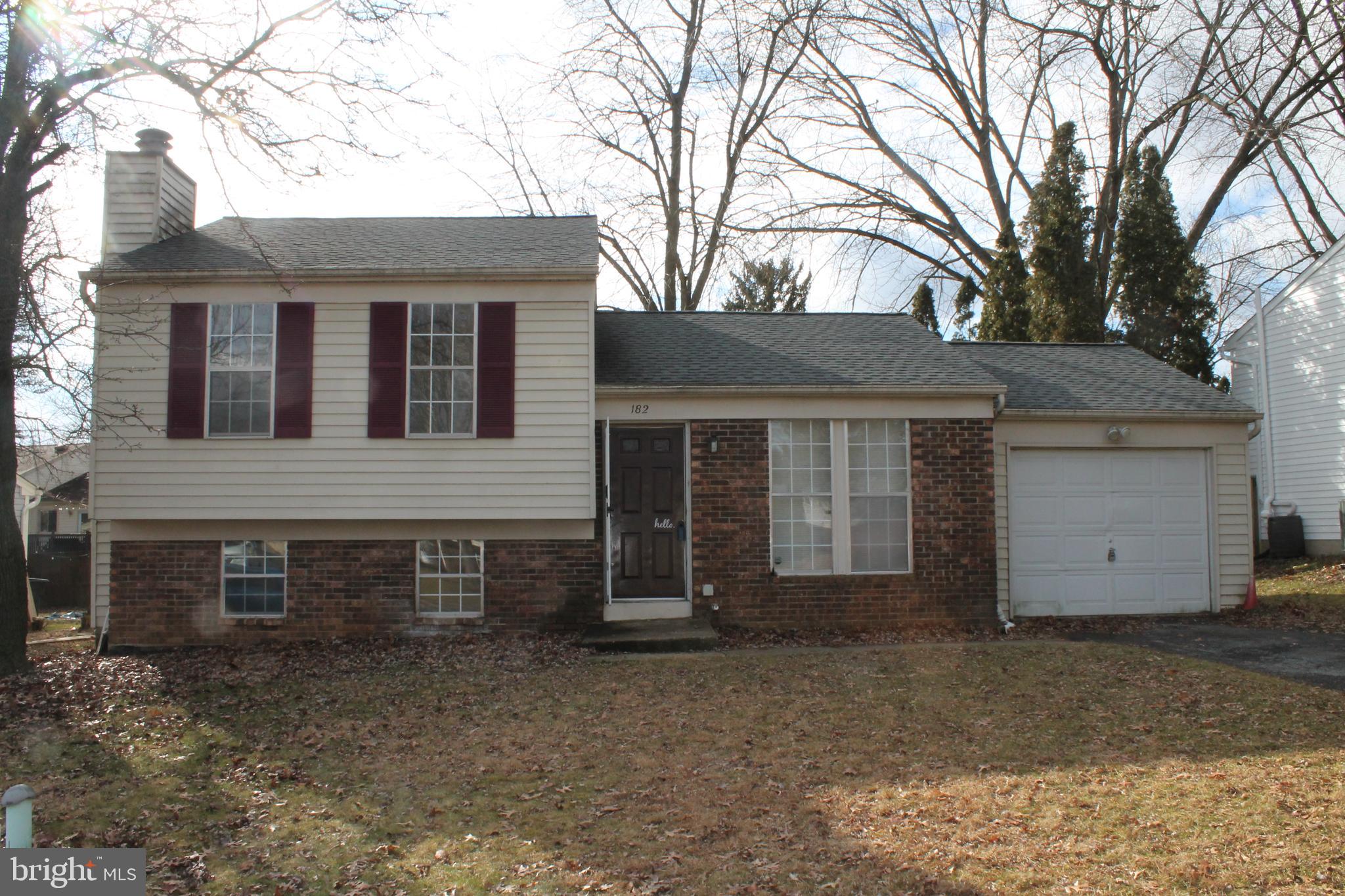 182 Warren Way Lancaster, PA 17601 - Photo 1 of 18 a front view of a house with a yard and garage
